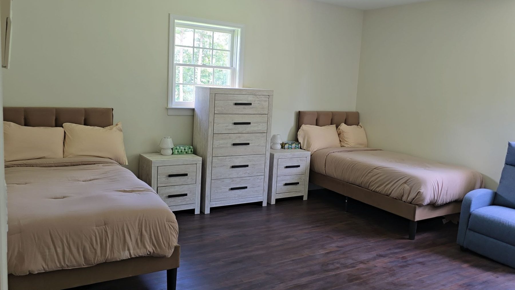Resident bedroom with dresser and nightstands