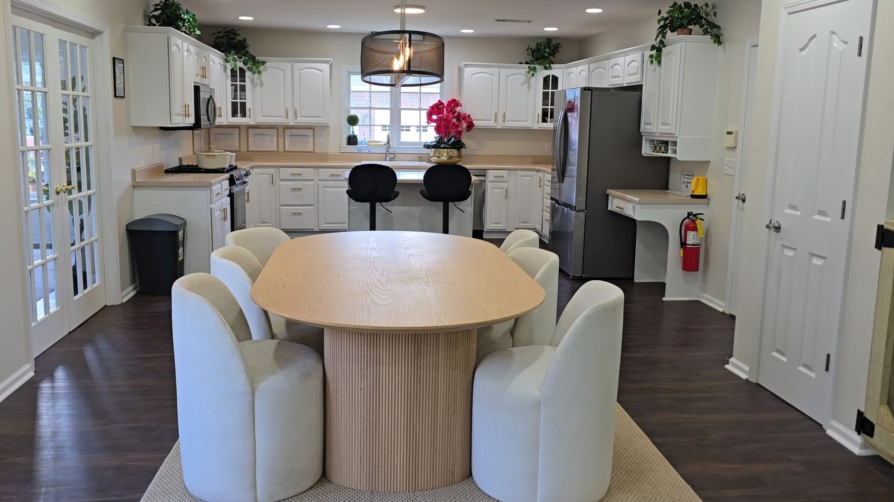 Open-concept kitchen, dining, and living area at Blossom Hill Senior Living